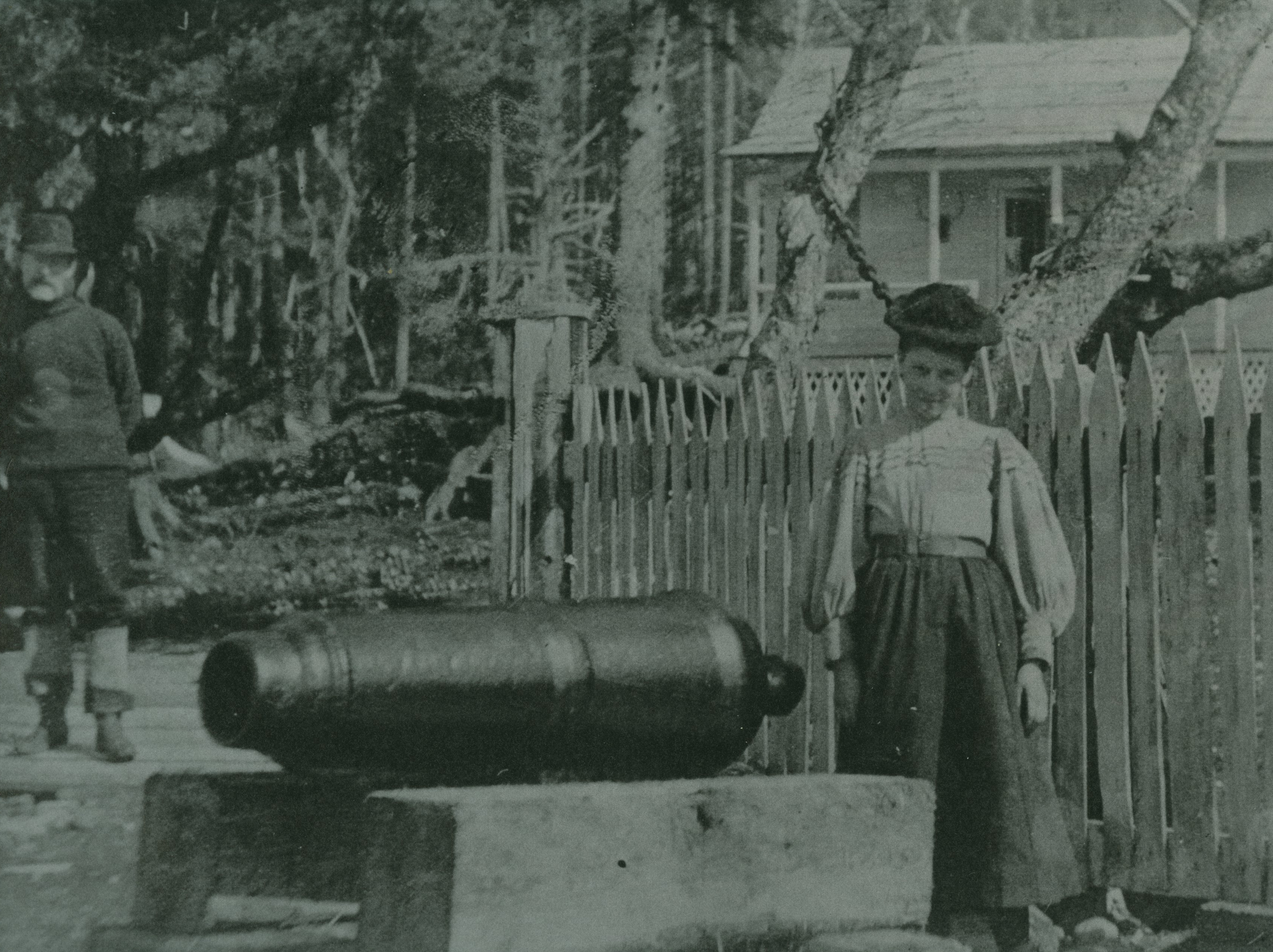 Austin's wife and the original cannon that Cannon Beach was named for, circa 1898 - 1900.